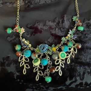 Fun, costume jewellery necklace with fruit and colourful bead pendants
